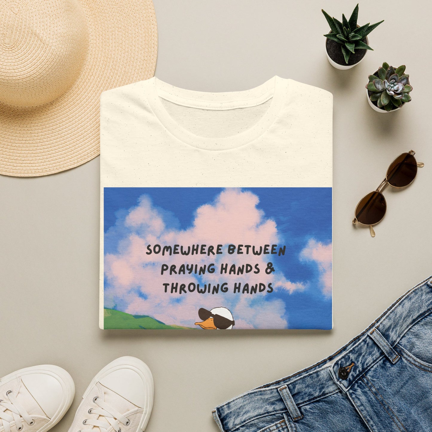 T‑Shirt — "Somewhere Between Praying Hands & Throwing Hands" Cute Goose Tee