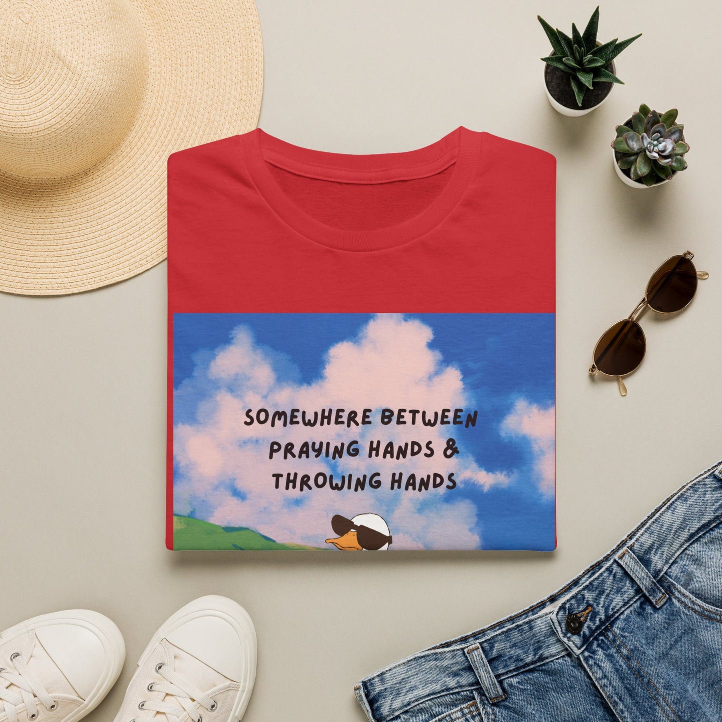 T‑Shirt — "Somewhere Between Praying Hands & Throwing Hands" Cute Goose Tee