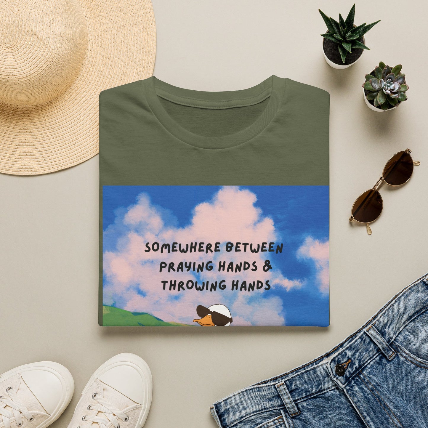 T‑Shirt — "Somewhere Between Praying Hands & Throwing Hands" Cute Goose Tee