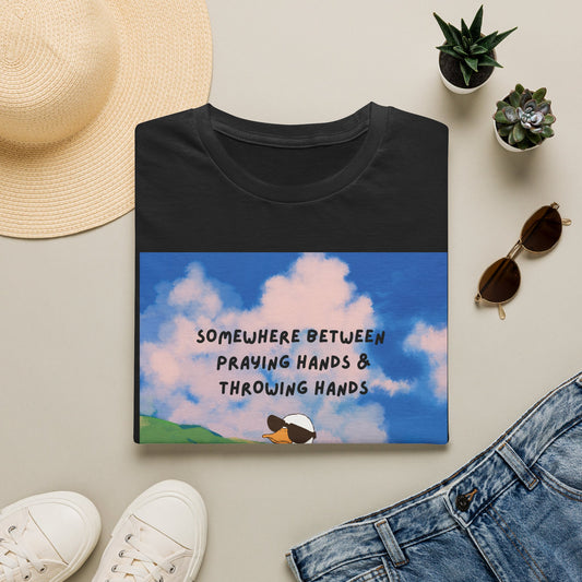 T‑Shirt — "Somewhere Between Praying Hands & Throwing Hands" Cute Goose Tee