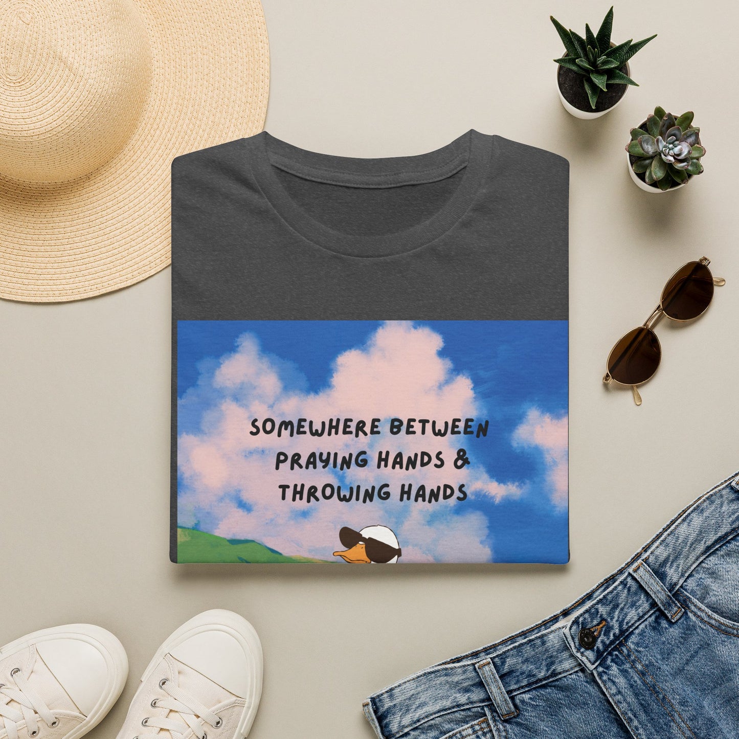 T‑Shirt — "Somewhere Between Praying Hands & Throwing Hands" Cute Goose Tee