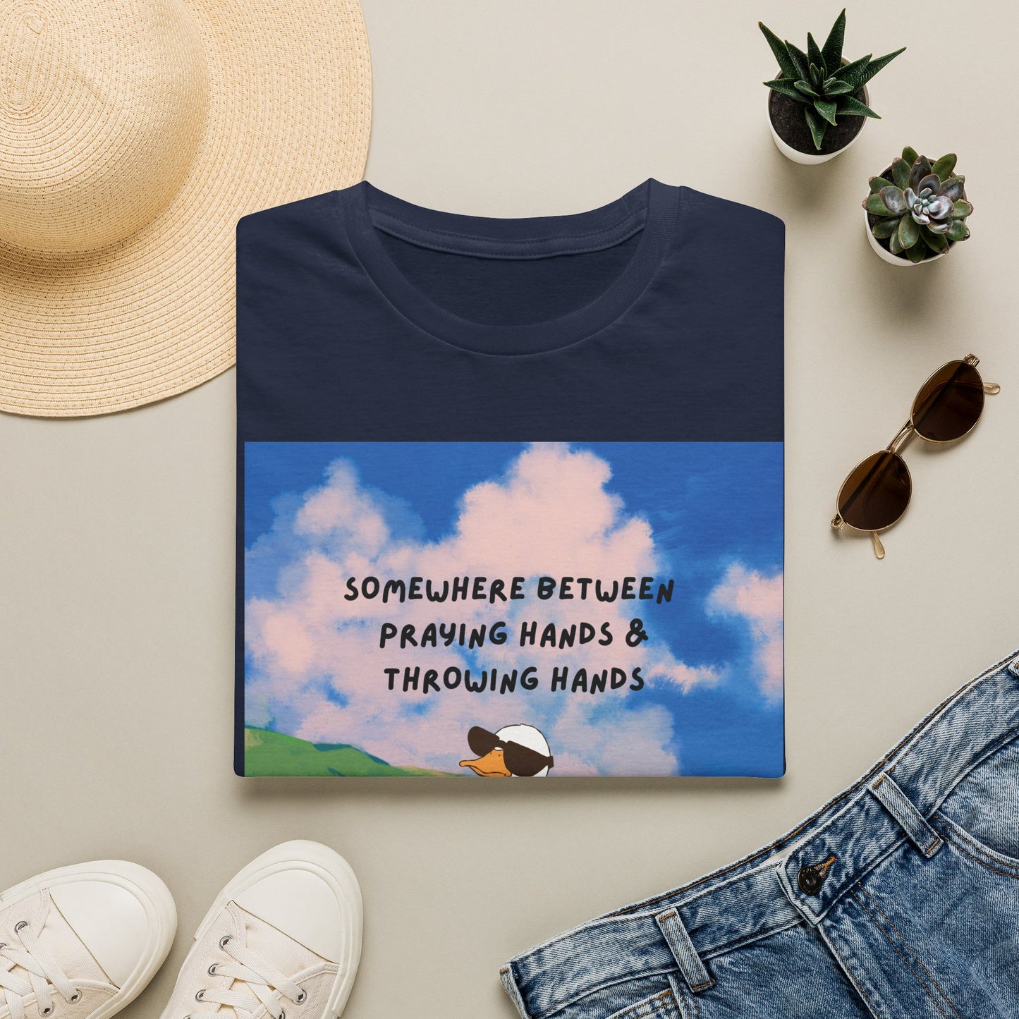 T‑Shirt — "Somewhere Between Praying Hands & Throwing Hands" Cute Goose Tee