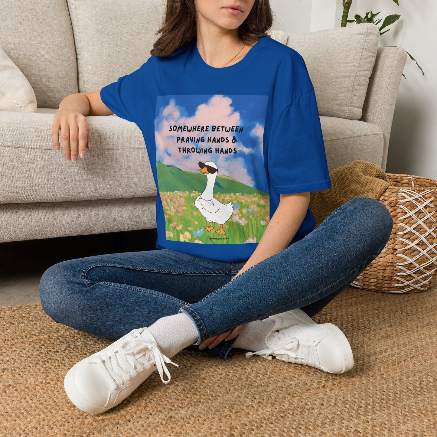 T‑Shirt — "Somewhere Between Praying Hands & Throwing Hands" Cute Goose Tee