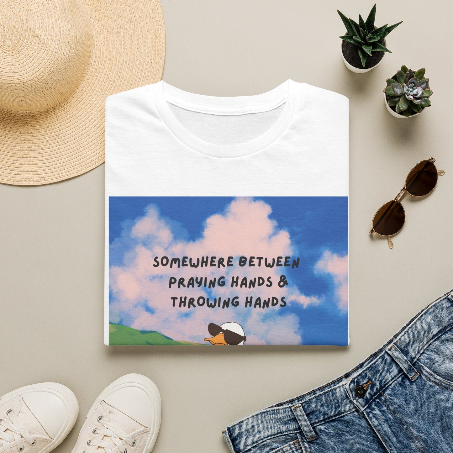 T‑Shirt — "Somewhere Between Praying Hands & Throwing Hands" Cute Goose Tee