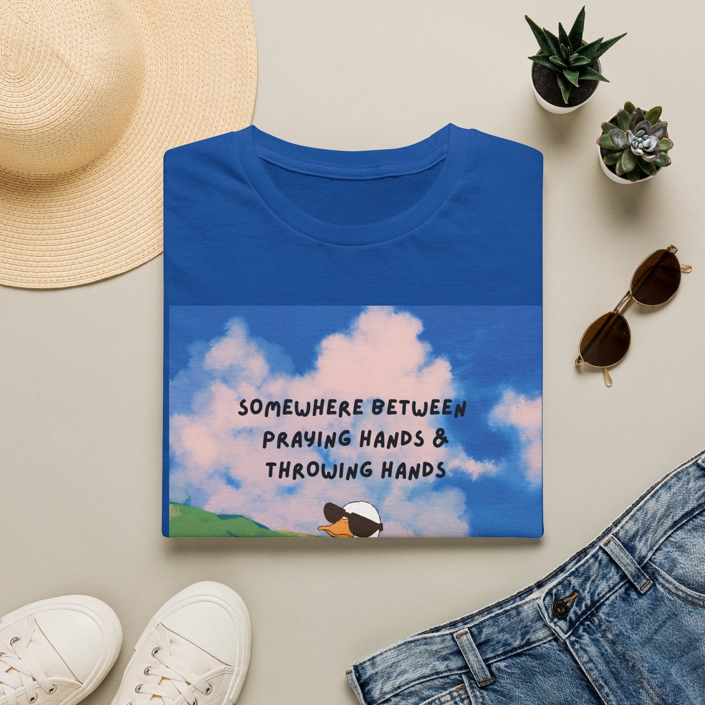 T‑Shirt — "Somewhere Between Praying Hands & Throwing Hands" Cute Goose Tee